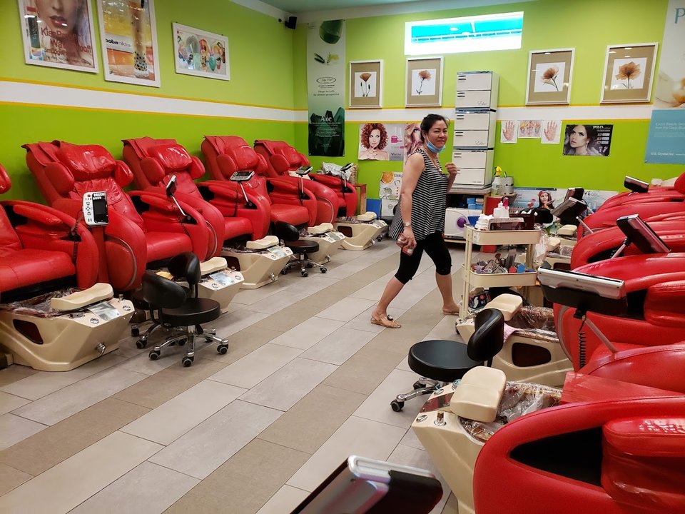 Salon chairs beside manicure stations